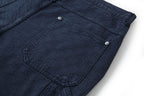 Navy wide-leg pants with large patch pocket and silver snap buttons