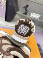 Women's Louis Vuitton low-top sneakers, heel close-up, brown with LV patch and white laces