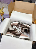 Women's Louis Vuitton low-top sneakers in brown with white laces and monogram panels