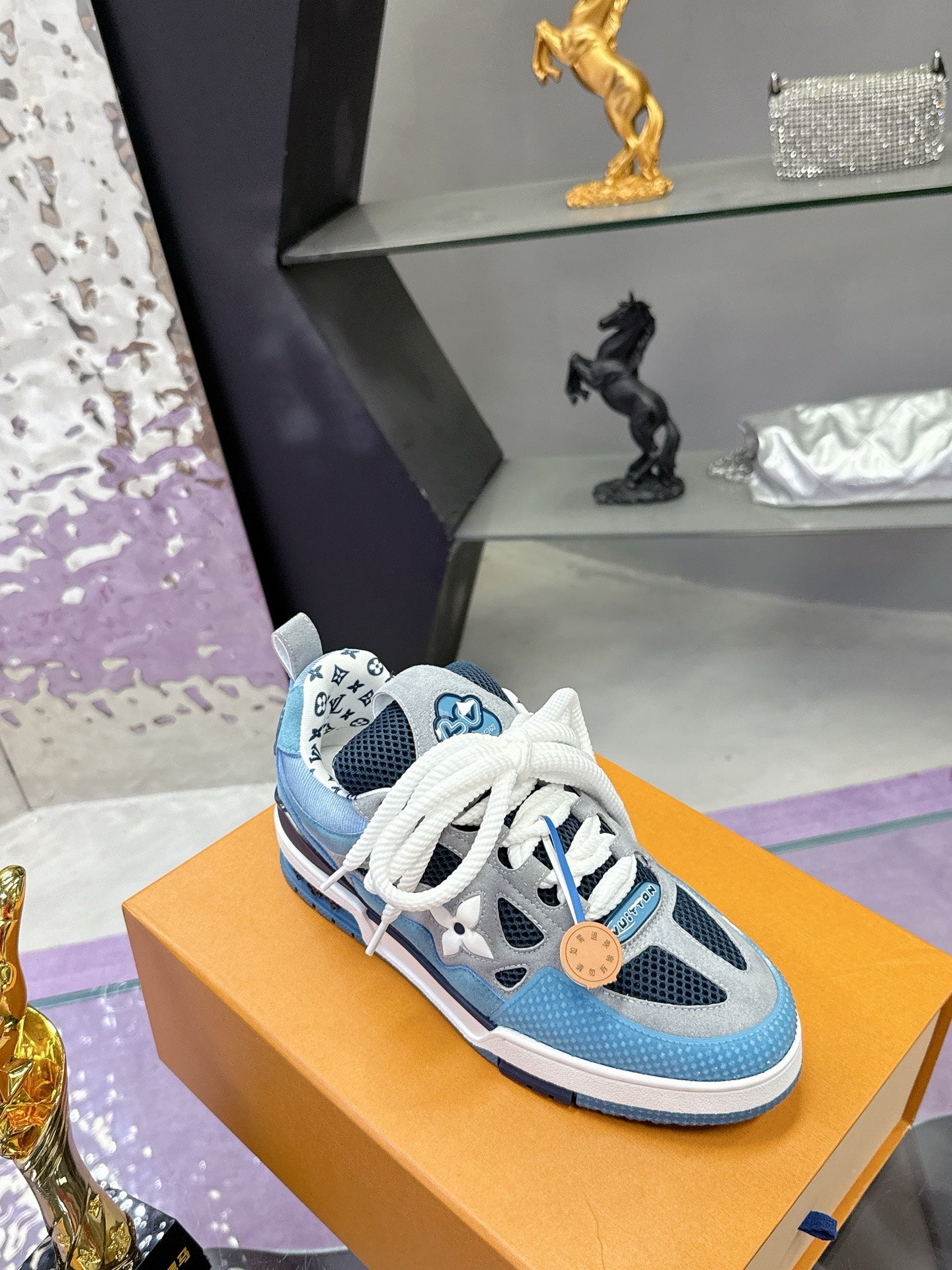 Blue Louis Vuitton women’s sneakers with white laces and black-and-white sole trim