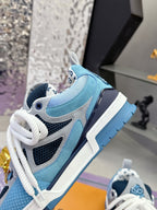Blue Louis Vuitton women’s sneaker side view with white laces and textured mesh