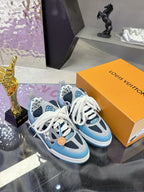 Blue Louis Vuitton women’s sneakers with white laces and tan logo tag