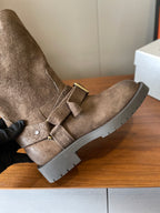 Close-up suede ankle boot with front buckle strap and lug sole, taupe