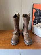 Suede ankle boots with gold-tone buckle straps and lug soles, taupe