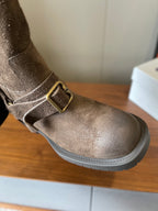 Side view suede ankle boot with metal buckle strap, taupe