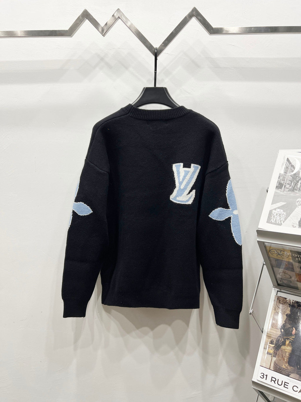 Dark navy crewneck sweater with Louis Vuitton logo and light blue sleeve patches
