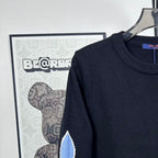 Louis Vuitton long-sleeve sweater neckline and blue LV star detail on shoulder