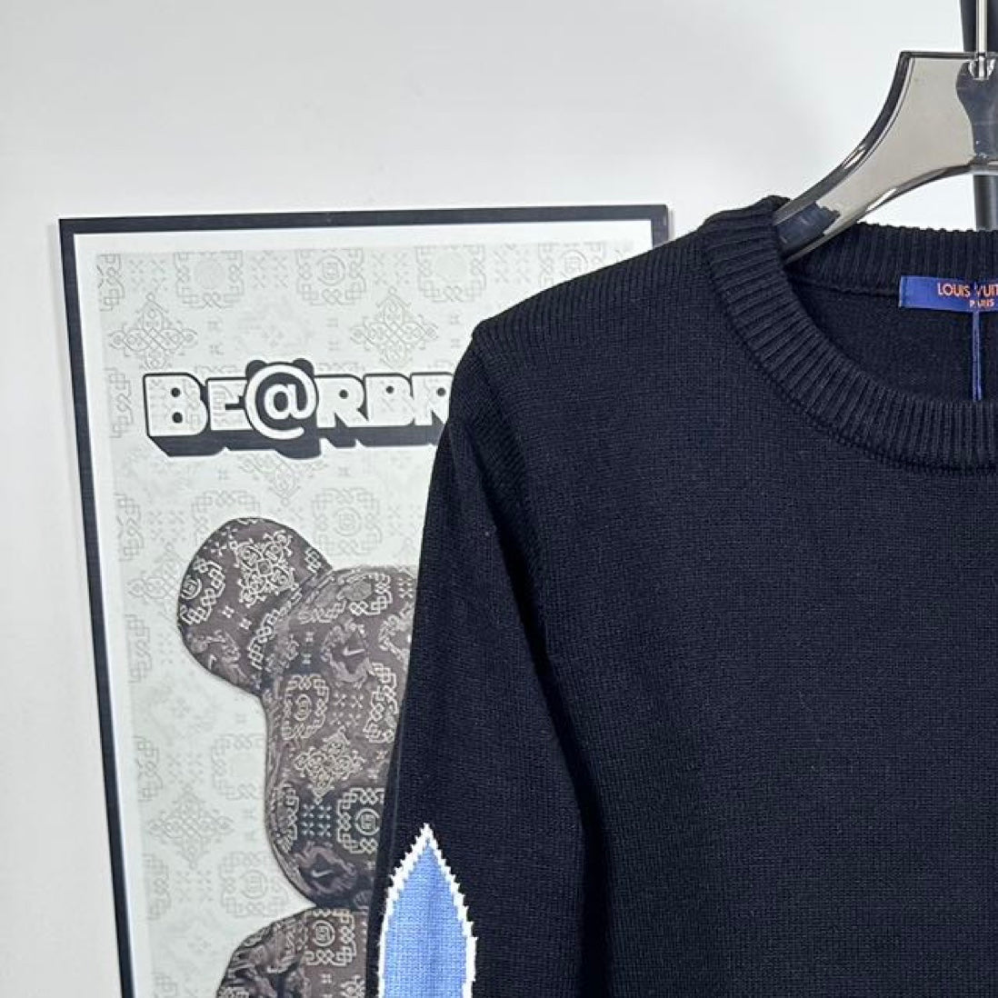 Louis Vuitton long-sleeve sweater neckline and blue LV star detail on shoulder