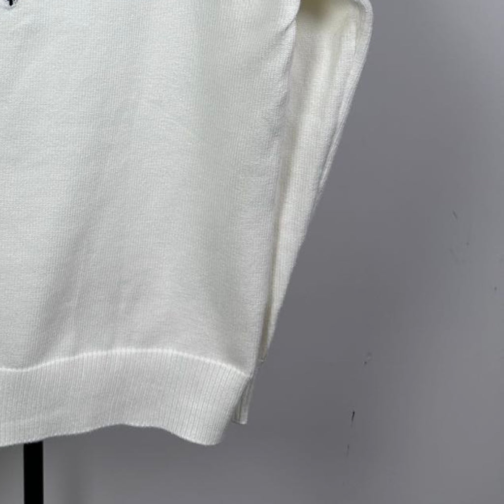 Long-sleeve knit sweater in white with ribbed lower hem and textured knit fabric