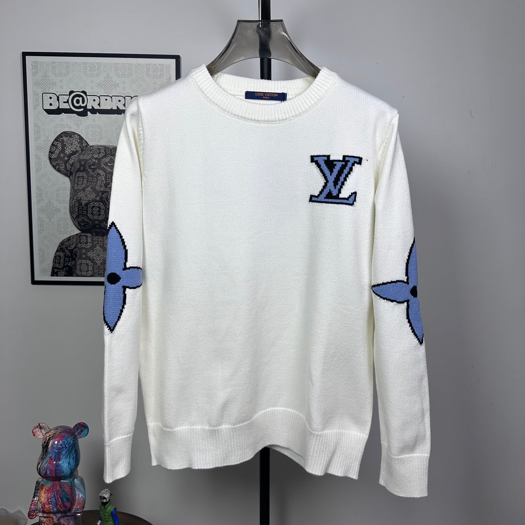 Long-sleeve knit sweater in white with blue logo motif on chest and sleeves