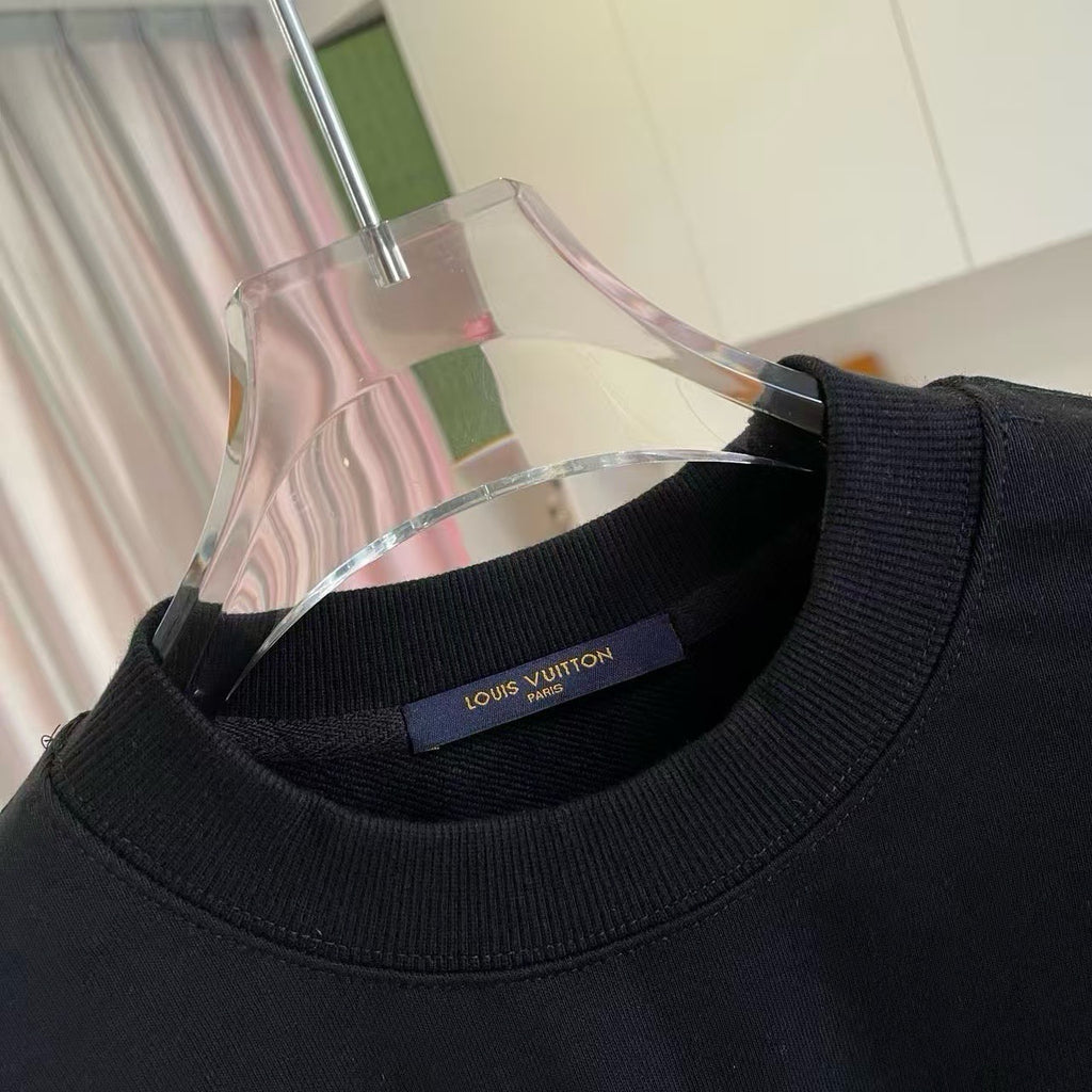 Black crewneck sweatshirt neckline with Louis Vuitton label