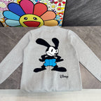 Light gray sweatshirt with back Mickey Mouse graphic wearing blue shorts