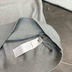 Light gray knit sweatshirt neck with small white brand label tag