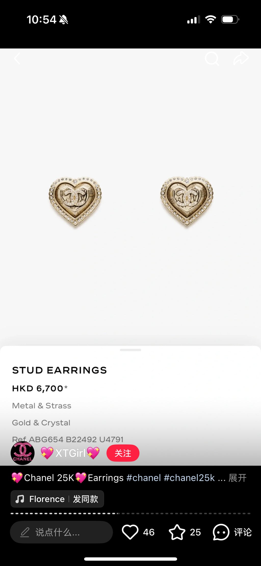 Gold-tone heart stud earrings with small rhinestone details on a plain background