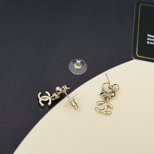 Chanel dangle earrings with gold-tone studs and floral cluster charms