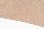 Beige ribbed knit sweater hem with fine stitch texture