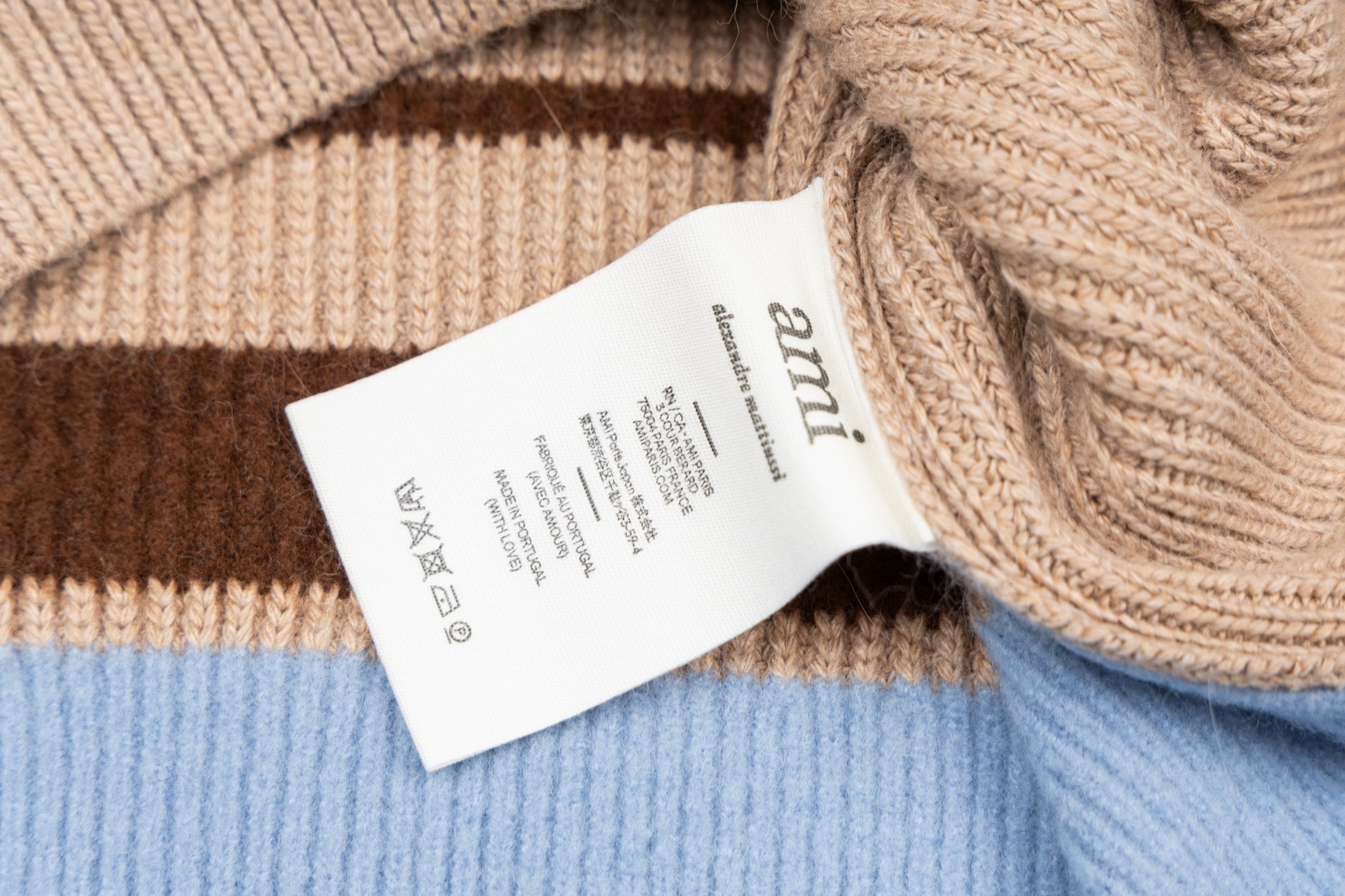 Beige ribbed knit sweater with Amiri care label