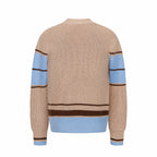 Beige knit sweater back with blue ribbed hem band and brown stripe cuffs