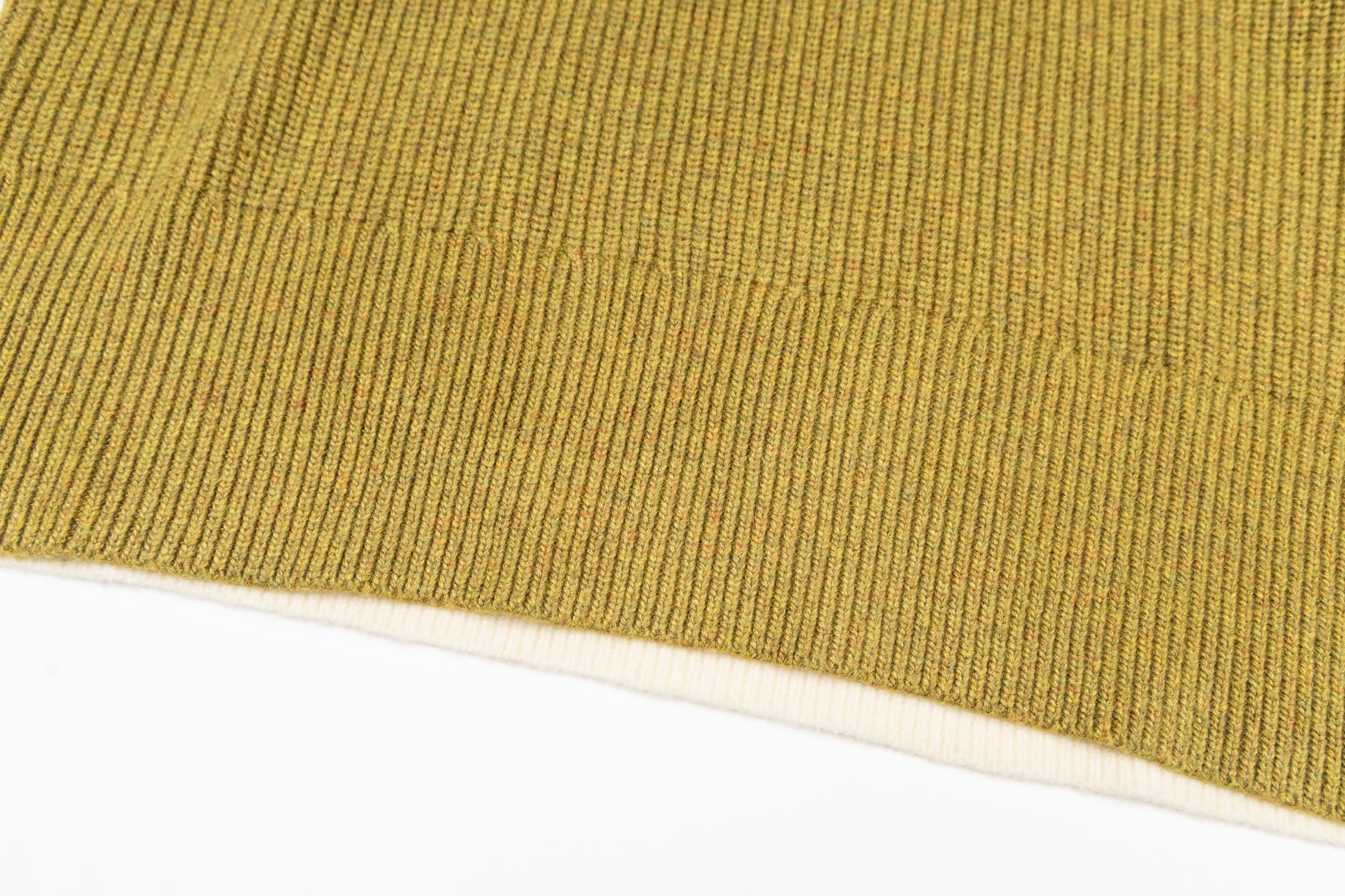 Knit sweater hem and ribbed edge with white stripe band