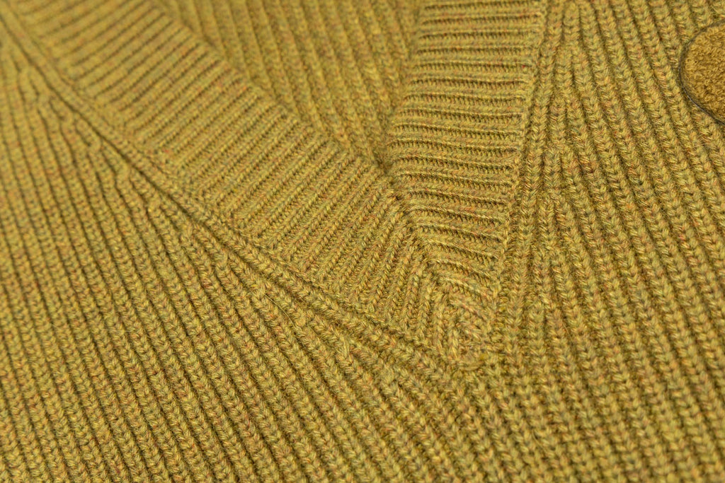 V-neck knit sweater fabric close-up with textured rib knit pattern