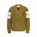 V-neck knit sweater with long sleeves, striped cuffs, and A heart applique on chest