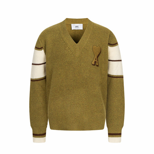 V-neck knit sweater with long sleeves, striped cuffs, and A heart applique on chest