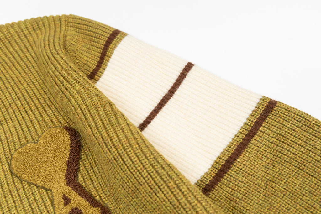 Striped knit sleeve cuff with white and brown bands