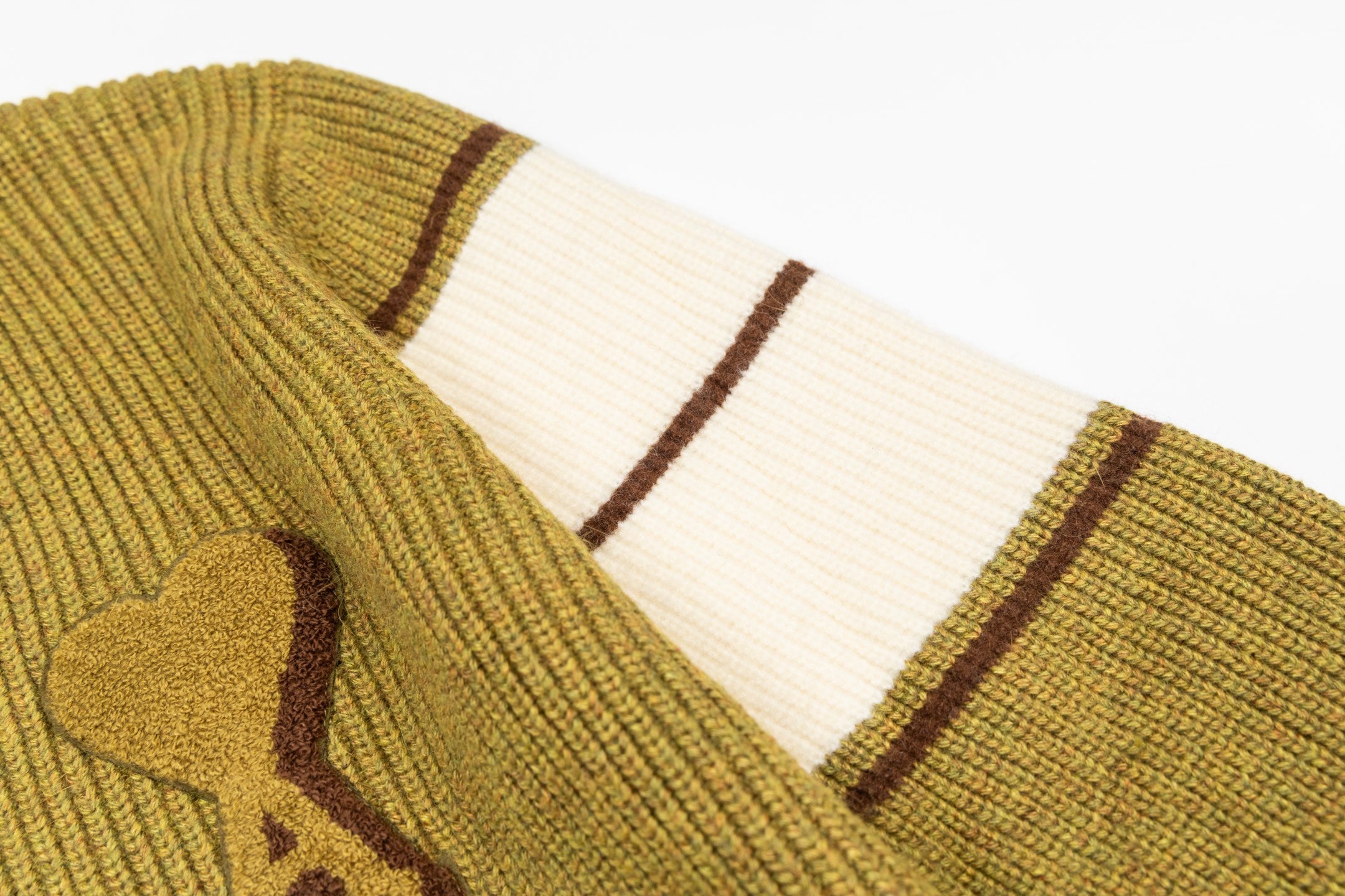 Striped knit sleeve cuff with white and brown bands