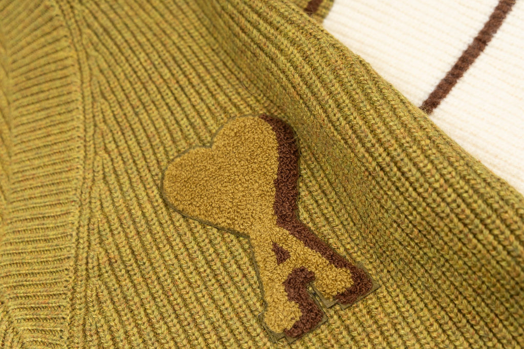 A heart applique detail on knit sweater front