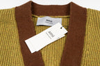 Olive cardigan neckline with brown V-placket and tag at center front