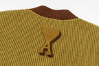 Olive knit cardigan shoulder with embroidered bone logo on brown trim