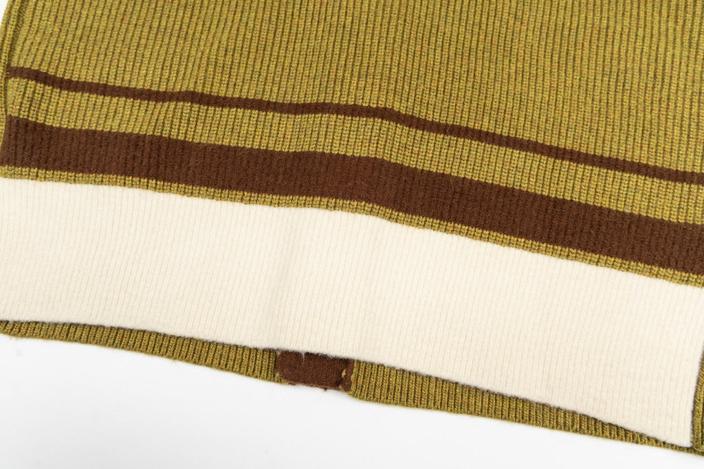 Yellow knit fabric with dark brown stripe and banded hem detail