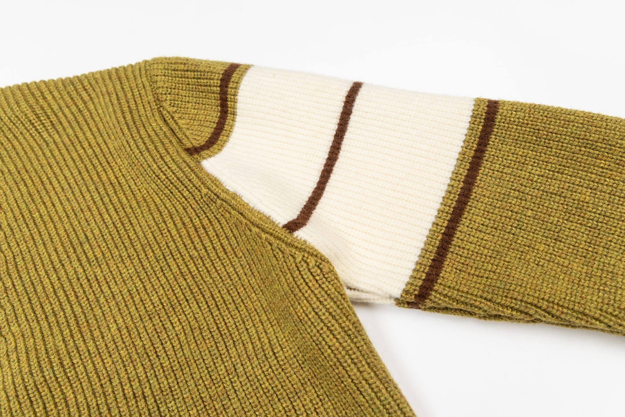 Olive cardigan collar with brown trim and white striped sleeve hem