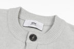 Light gray knit collar with button placket and interior brand label