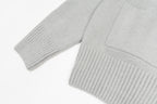 Light gray knit cardigan sleeve and ribbed cuff with sweater hem