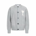 Light gray knit cardigan with button front and white heart logo with letter A