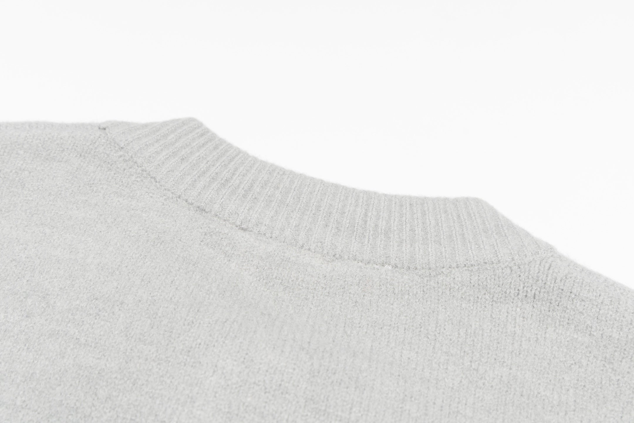 Light gray ribbed knit neckline and collar detail