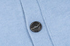 Amiri light blue knit cardigan close-up of black button on front placket