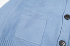 Amiri light blue knit cardigan front with patch pockets and black buttons