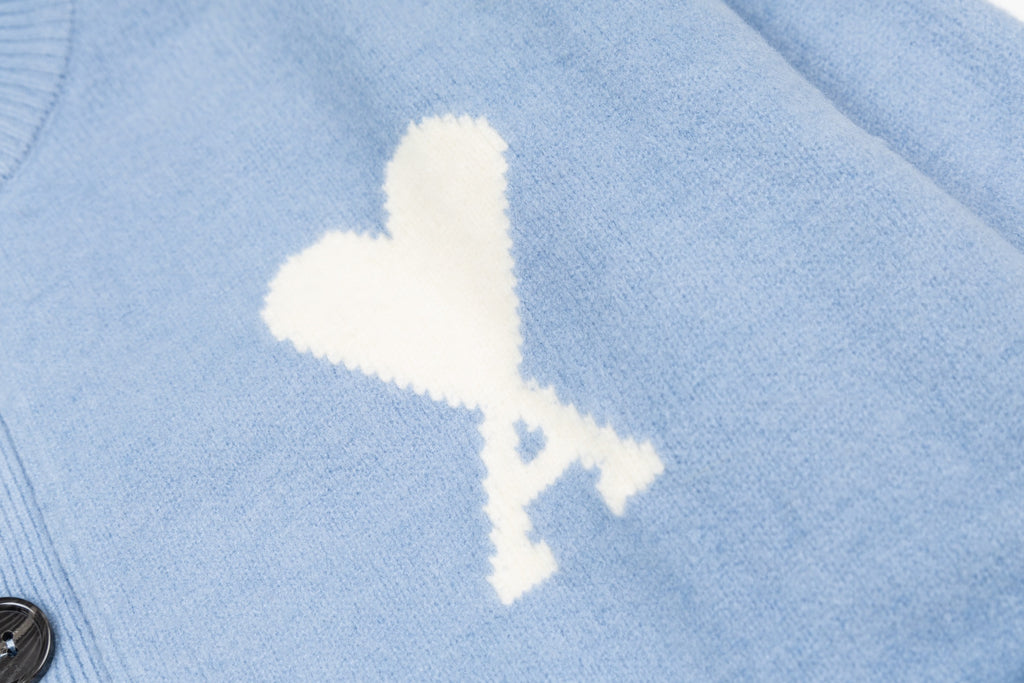 Amiri light blue knit cardigan with white lightning logo detail on chest