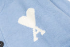 Amiri light blue knit cardigan with white lightning logo detail on chest