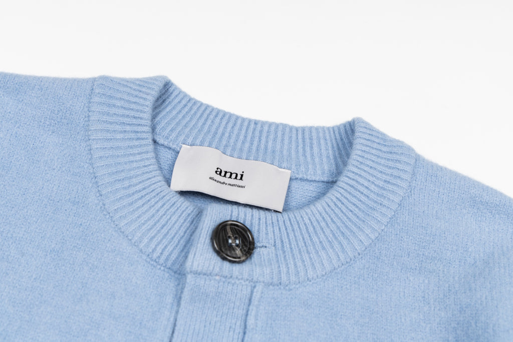 Amiri light blue knit cardigan neckline with button placket and brand tag