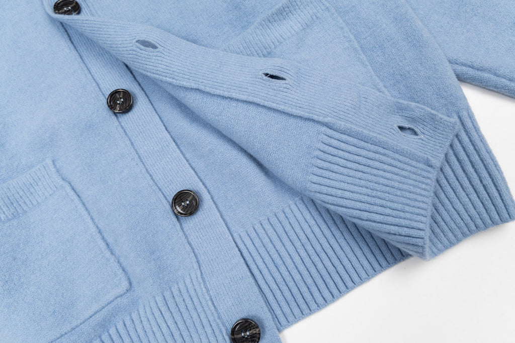 Light blue knit cardigan with ribbed cuffs and button front