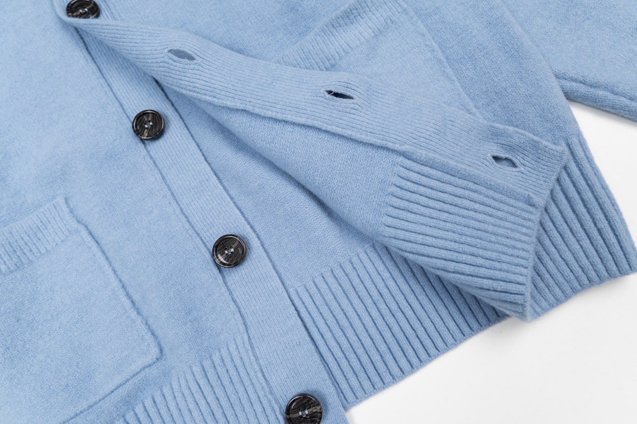 Light blue knit cardigan with ribbed cuffs and button front