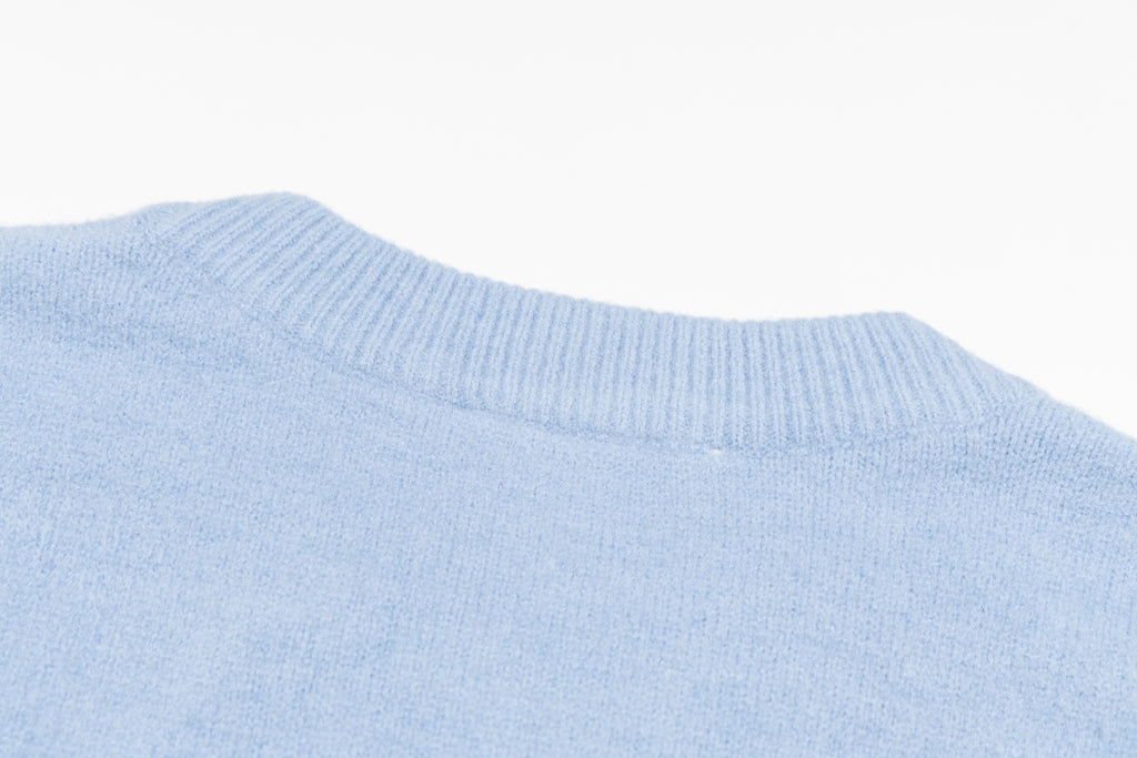 Amiri light blue crewneck sweater with ribbed collar and knit texture