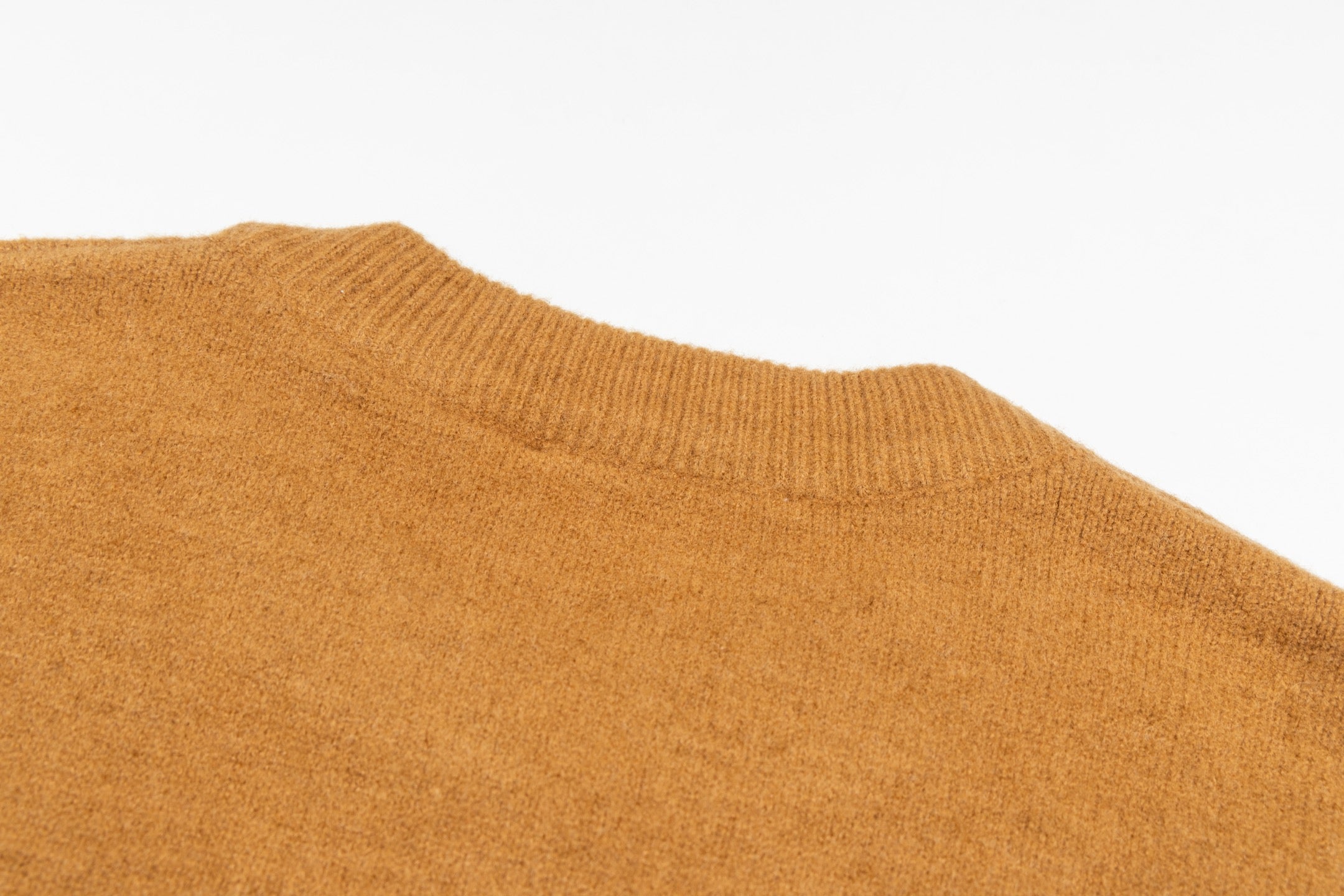 Camel brown crewneck sweater with smooth knit texture