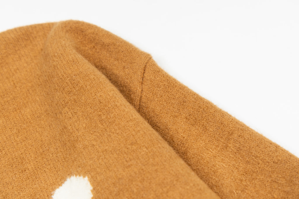 Camel brown sweater sleeve with ribbed cuff and white logo