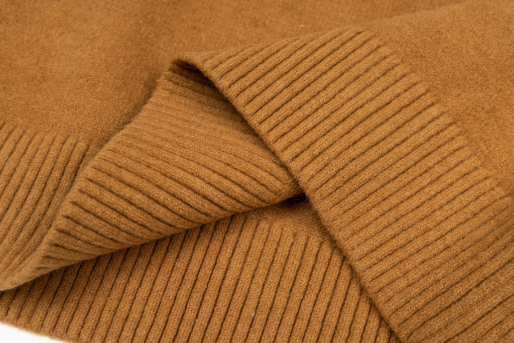 Camel brown sweater knit with ribbed cuff detail and layered fold