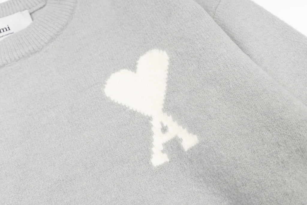 Amiri knit sweater with white heart A emblem on the chest