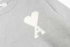 Amiri knit sweater with white heart A emblem on the chest